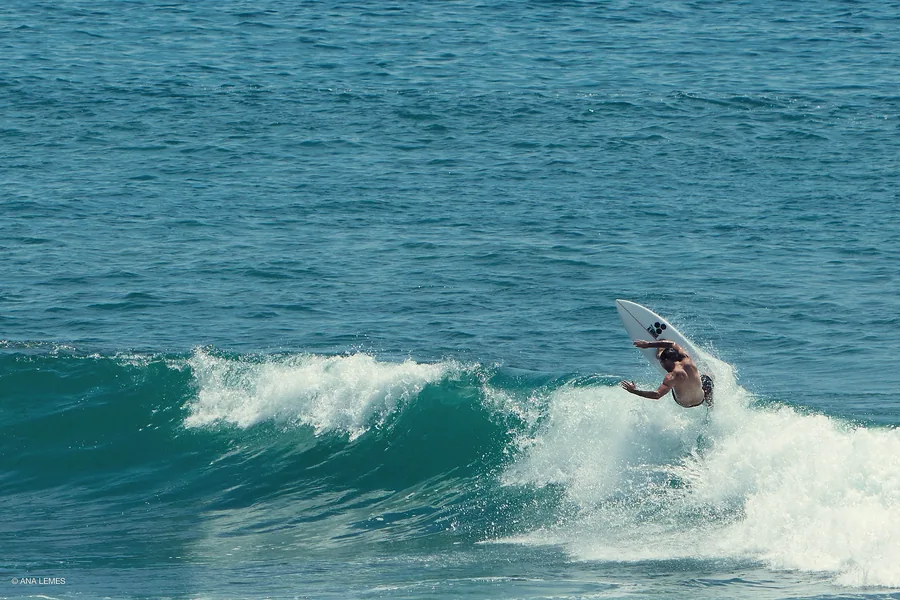 Surfer carving a wave