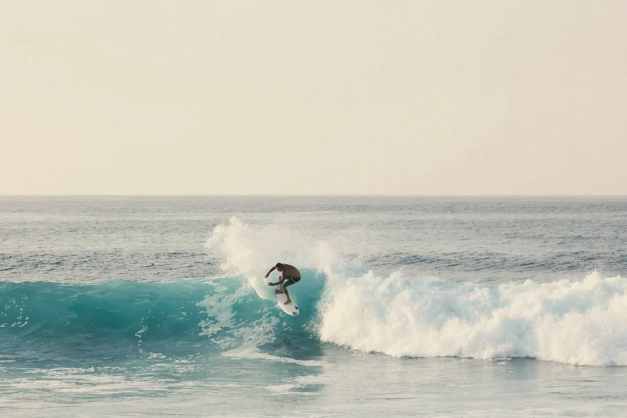 Surfer carving a wave